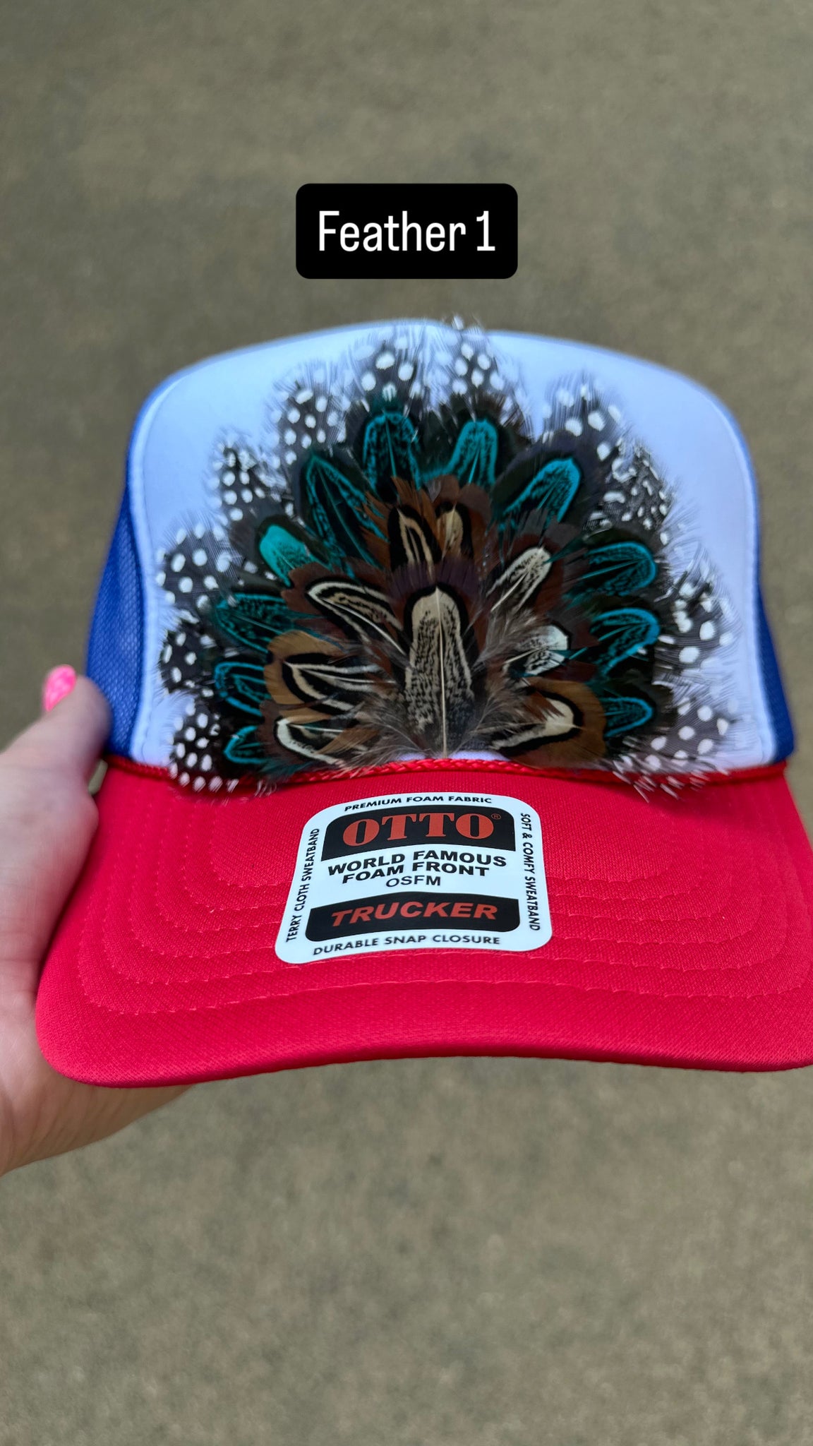 RED WHITE AND BLUE FEATHER TRUCKER HAT